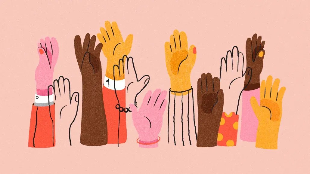 An illustration of varied, diverse hands reaching up from a crowd of people - representing community engagement for publishers, showing connection, interaction and long-term audience growth.
