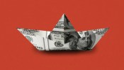 Paper boat made from $100 bills, representing how data connectivity helps optimize marketing spend and boost bookings for Windstar Cruises.